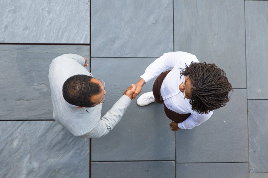 two people greeting each other