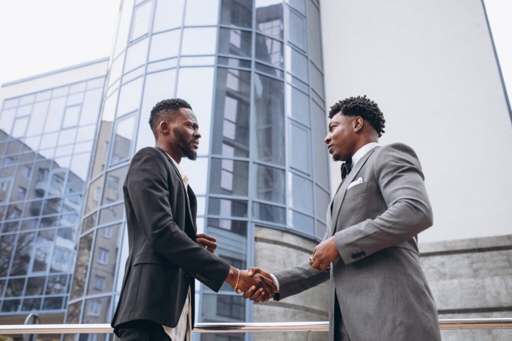 two black men shaking hands