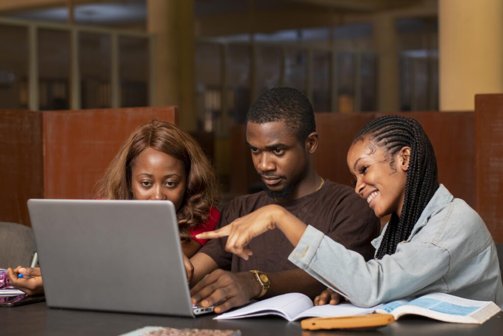 a group of black man and two ladies in an office