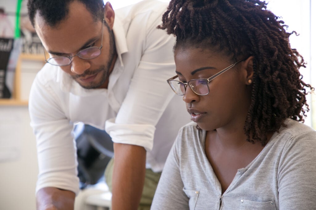 a black man and black woman learning