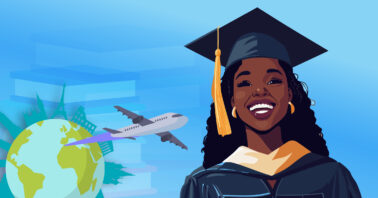 a black woman smiling in a graduation dress